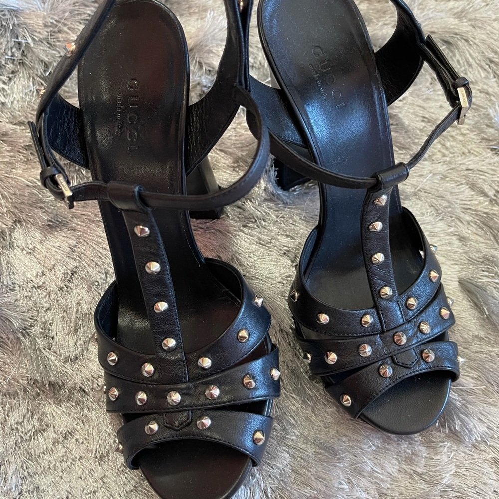 Black Gucci sandals.